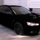 Image for article titled This Impossibly Black Lancer Evolution Uses Special Paint To Break Your Brain